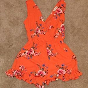 Orange floral romper $10 large